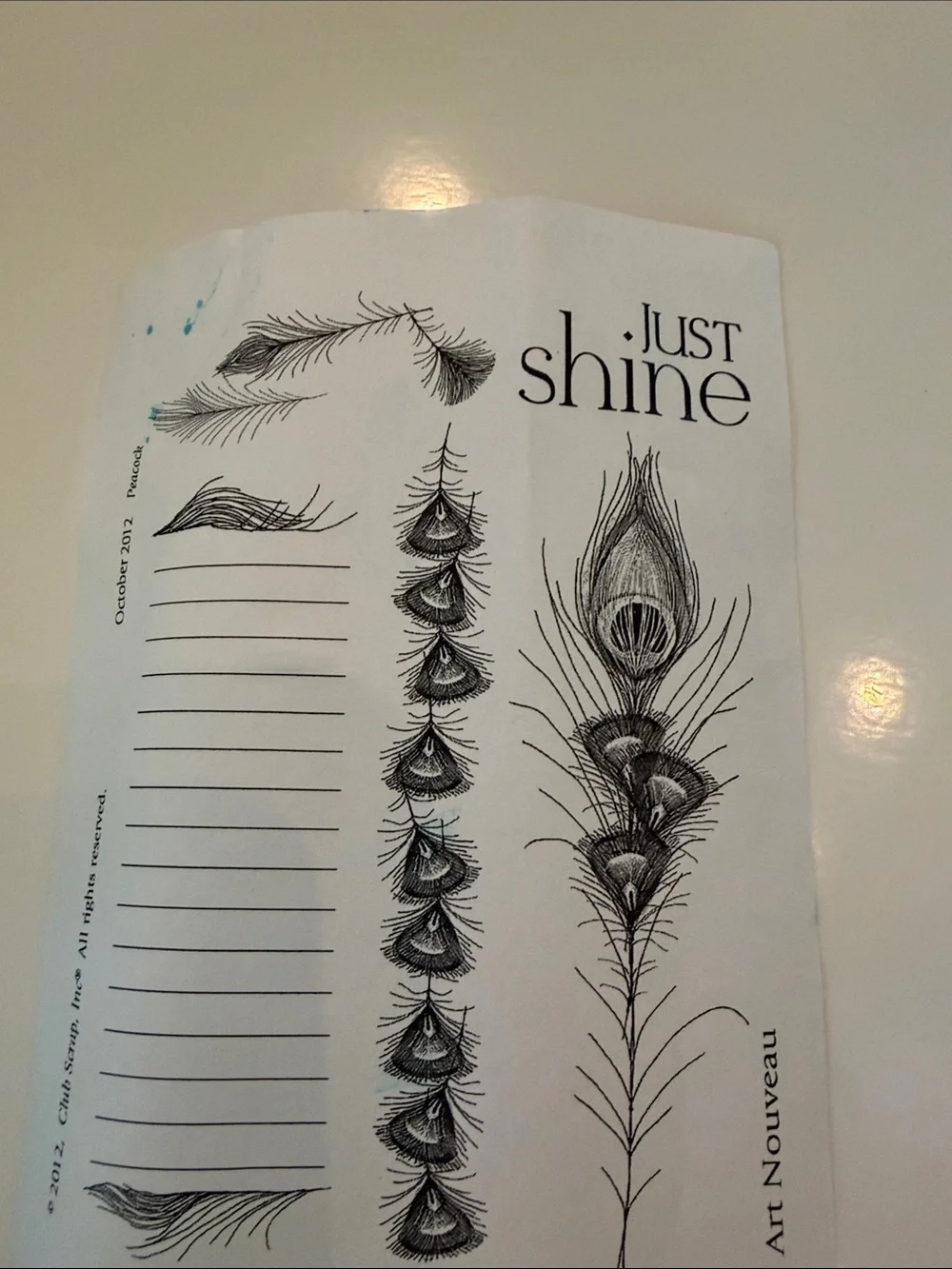 Set of 7  Peacock Feather and Script Stamps in a plastic binder by Club scrap